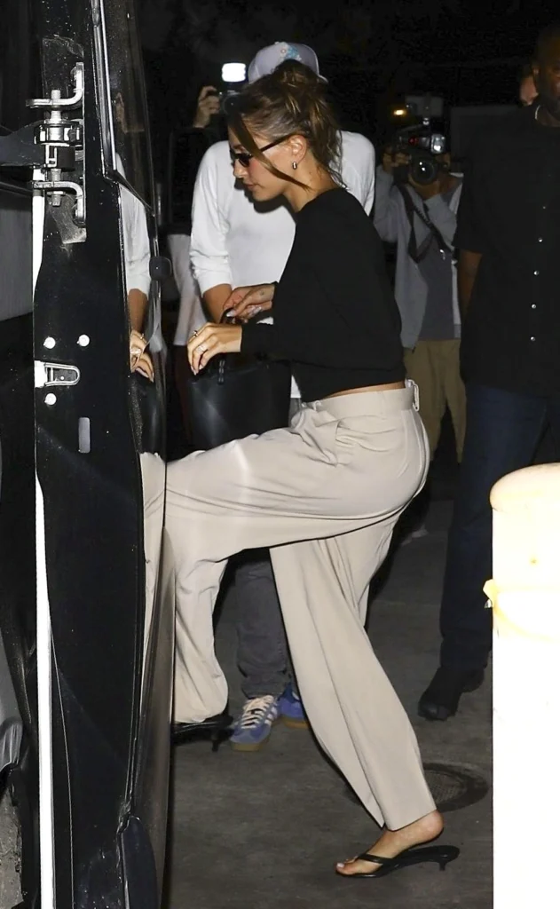 Beige trousers over dress